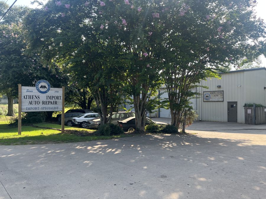 Parking lot and street sign at Athens Import Auto Repair, 835 Winterville Rd